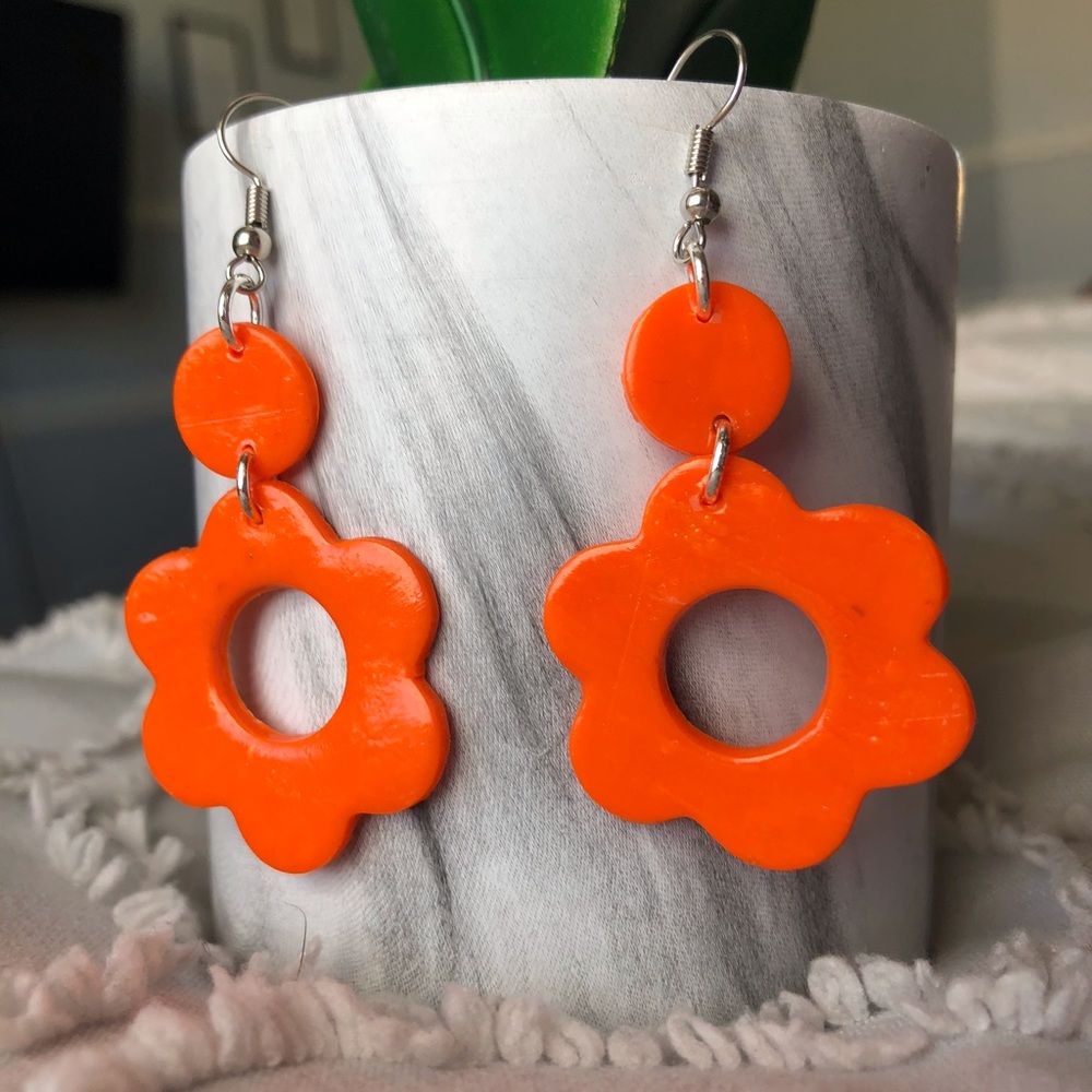 70s Groovy Orange flower shaped earrings with a circular cut out